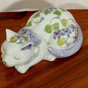 Beautiful Purple pansy sleeping cat